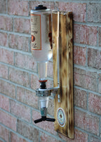 Wall-mounted bottle opener with wooden handle against a brick wall
