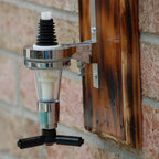 Wall-mounted beer dispenser against a brick wall