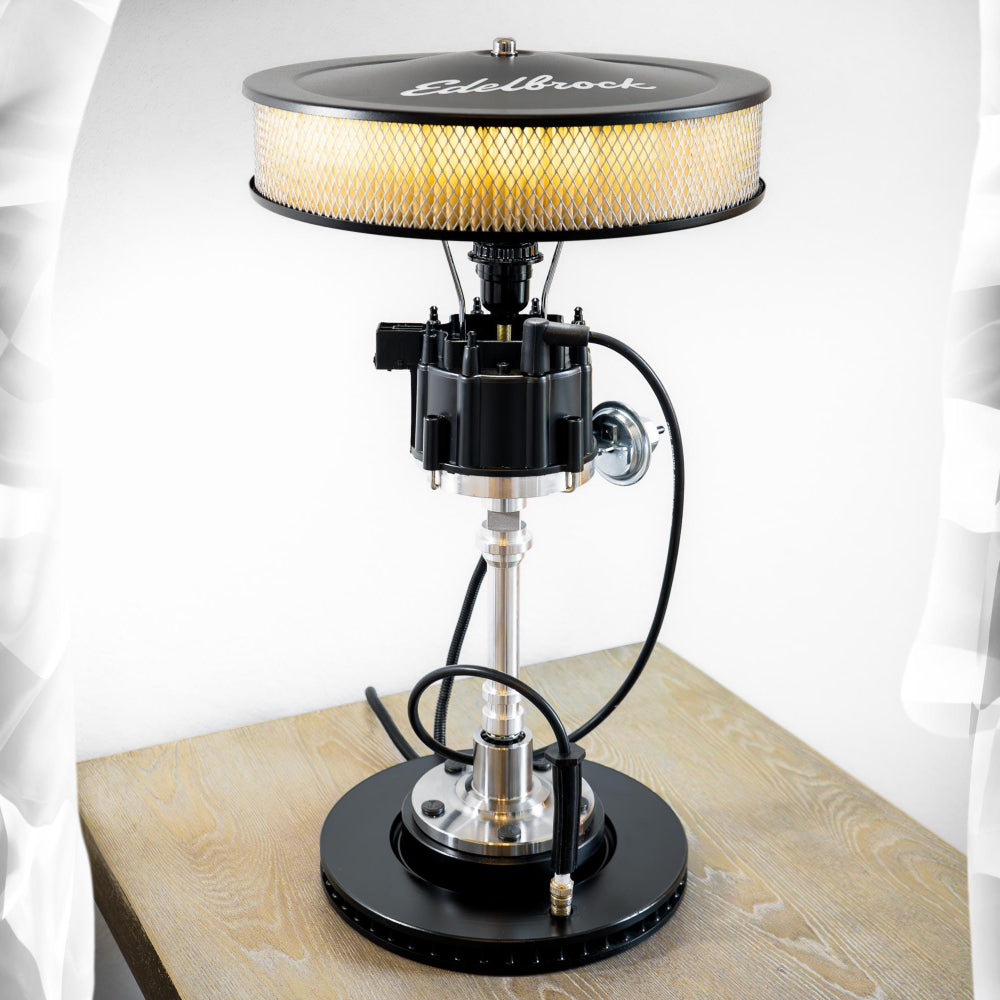 Distributor lamp featuring a lampshade made from a classic air filter, paired with genuine automotive hardware.
