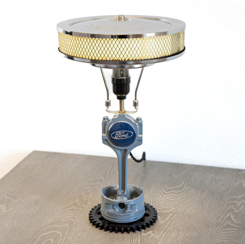 Automotive Ford piston table lamp crafted from a real engine piston, designed for subtle but unmistakable Ford decor.