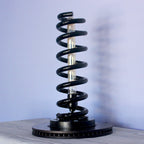 Automotive spring lamp made from real car components, blending industrial design with functional interior lighting.