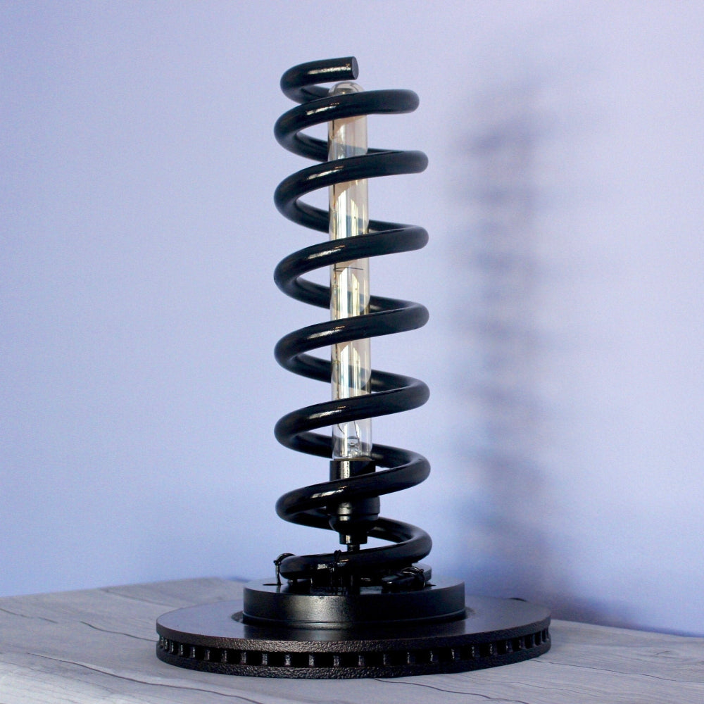 Automotive spring lamp made from real car components, blending industrial design with functional interior lighting.