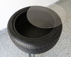 Stack of black tires on a concrete surface