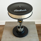 Chevy performance piston lamp featuring a real 350 piston and Edelbrock intake for bold motorsports appeal.