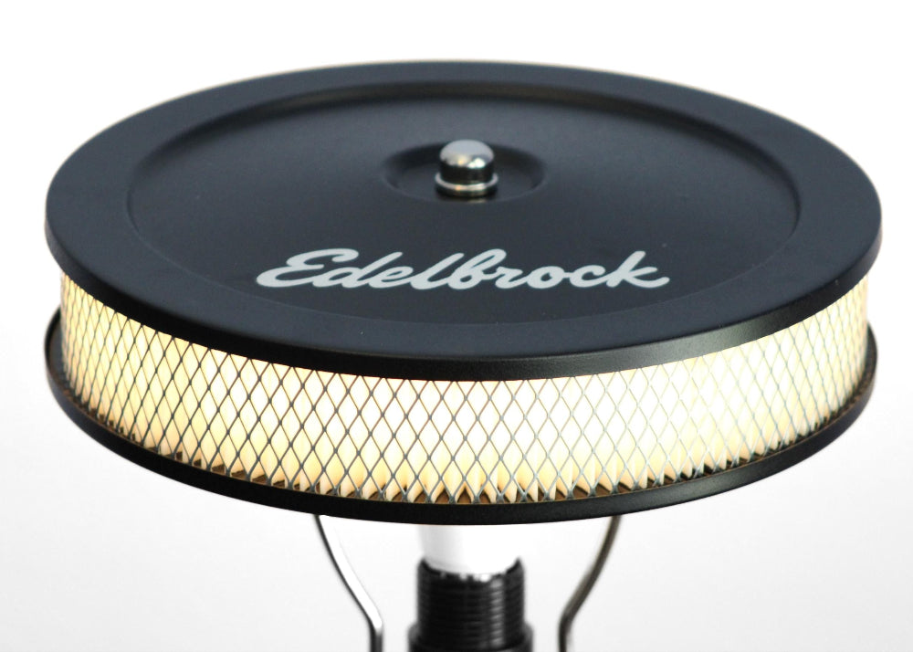 One of a kind Chevy piston lamp handcrafted from real car parts, offering authentic automotive decor with functional lighting.