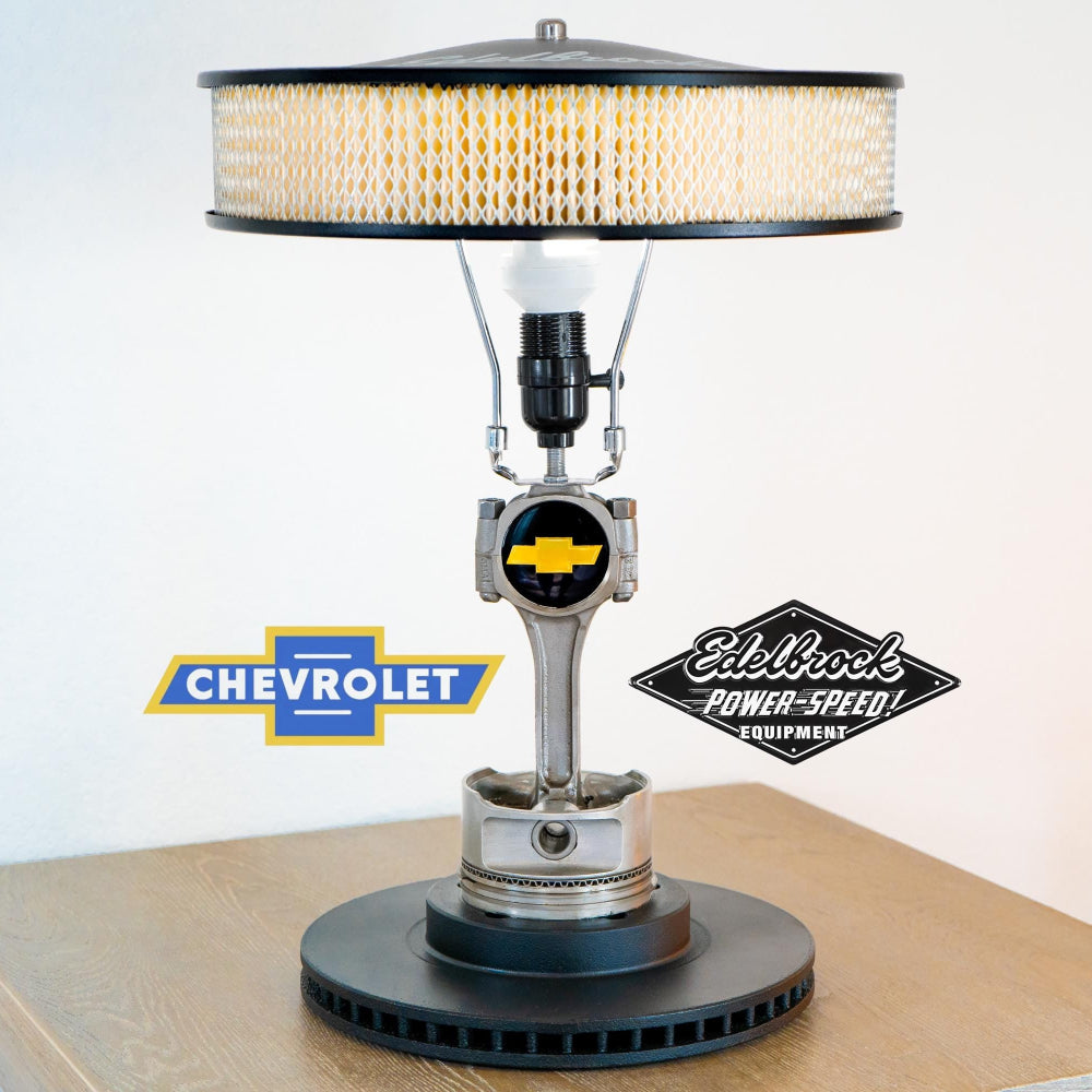 Chevy V8 piston lamp made from real engine parts, combining classic muscle car heritage with functional interior lighting.