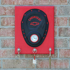 Decorative wall mount with Chevrolet logo on a brick wall