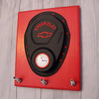 Red and black Chevrolet-themed wall hook on a wooden surface