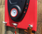 Red toolbox with a clock on a wooden background