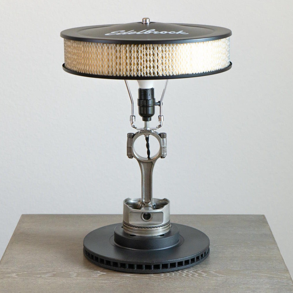 Classic Chevy muscle lamp built from real V8 components, blending mechanical detail with modern lighting design.