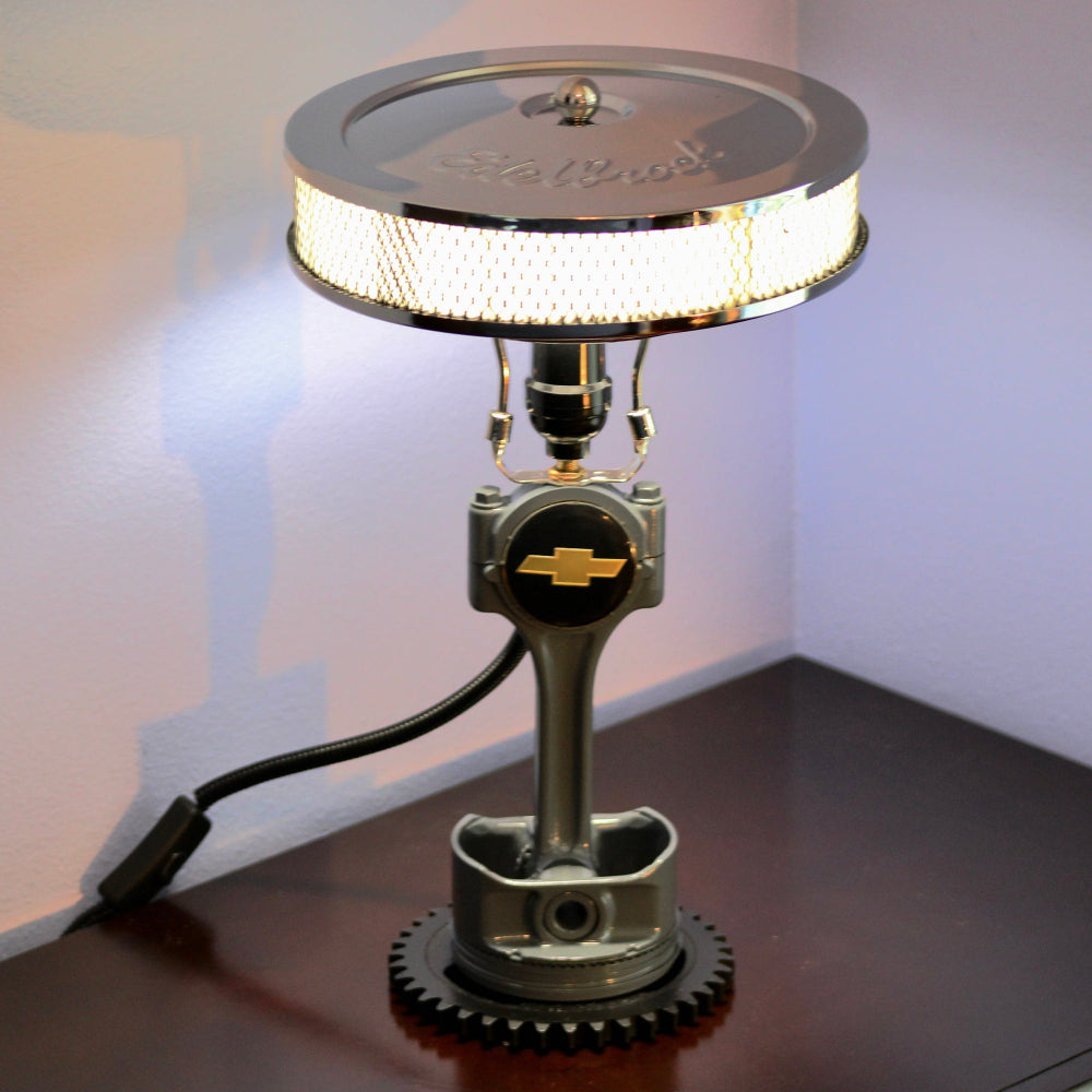 Custom Chevy piston lamp made from real car parts, offering personalized logo options and durable metal construction.