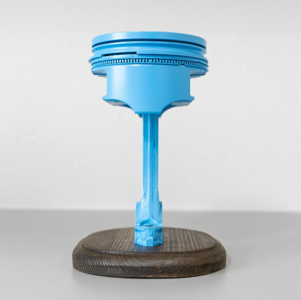 Custom color piston trophy built from real automotive component for car events.