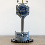 Ford piston lamp sized for desks or nightstands, made from genuine engine parts and styled for everyday interior use.