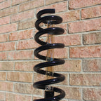 Garage style spring lamp designed for car lovers who appreciate raw, mechanical aesthetics.
