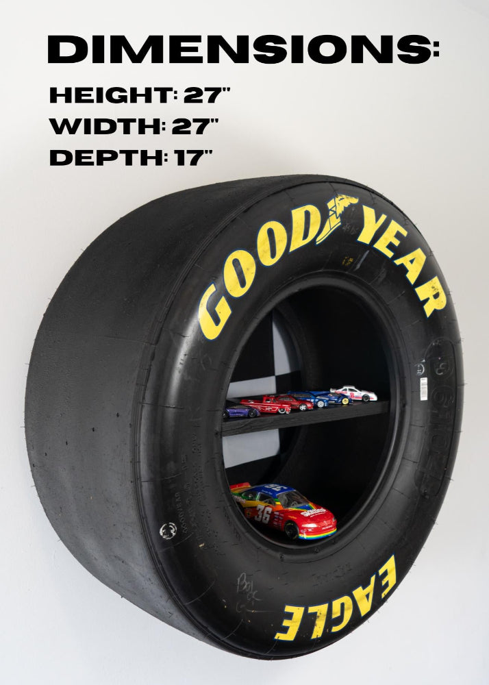 Garage wall display shelf made from real racing tire for automotive enthusiasts.