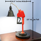 Gas station style nozzle lamp repurposed into a modern lighting piece with nostalgic mechanical character.