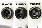 Goodyear Eagle racing tire shelf with integrated storage and checkered flag display backing.