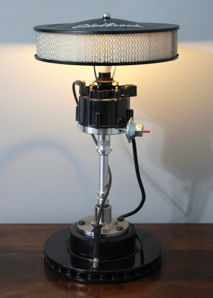 Handcrafted black distributor lamp built one at a time using real car parts with unique variations.