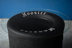 Handcrafted Hoosier tire table made one at a time from real racing tires for unique automotive furniture appeal.
