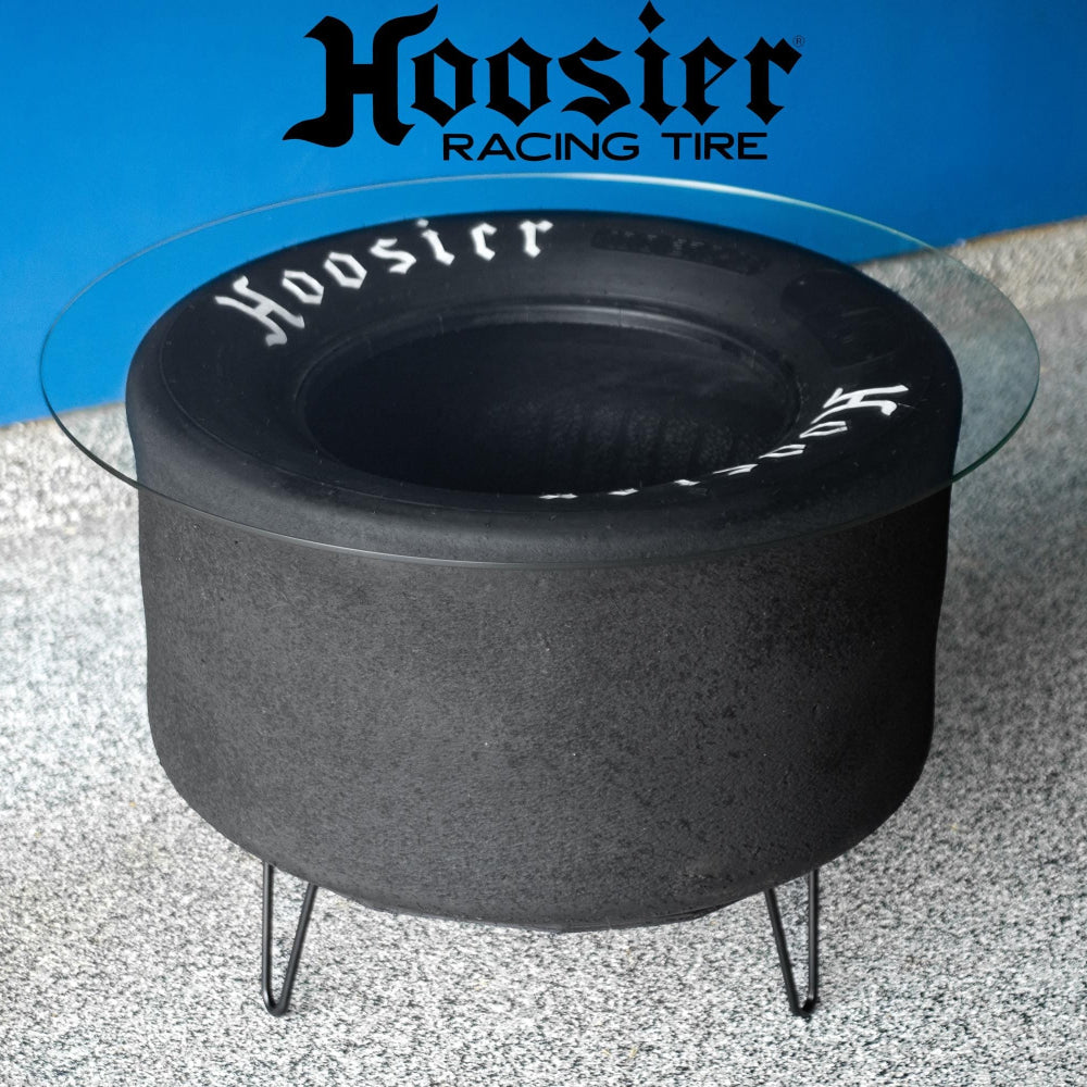 Hoosier tire coffee table handcrafted from a retired racing tire, sealed with a clear coat and built as bold automotive furniture.