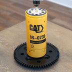 Industrial CAT equipment lamp featuring a black gear base inspired by real Caterpillar machinery.