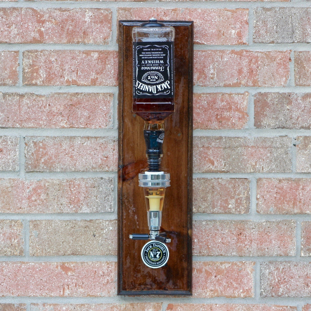 Wall mounted Jack Daniels liquor dispenser with precision shot pour and glossy epoxy finished wood backing.
