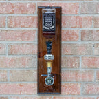 Wall mounted Jack Daniels liquor dispenser with precision shot pour and glossy epoxy finished wood backing.