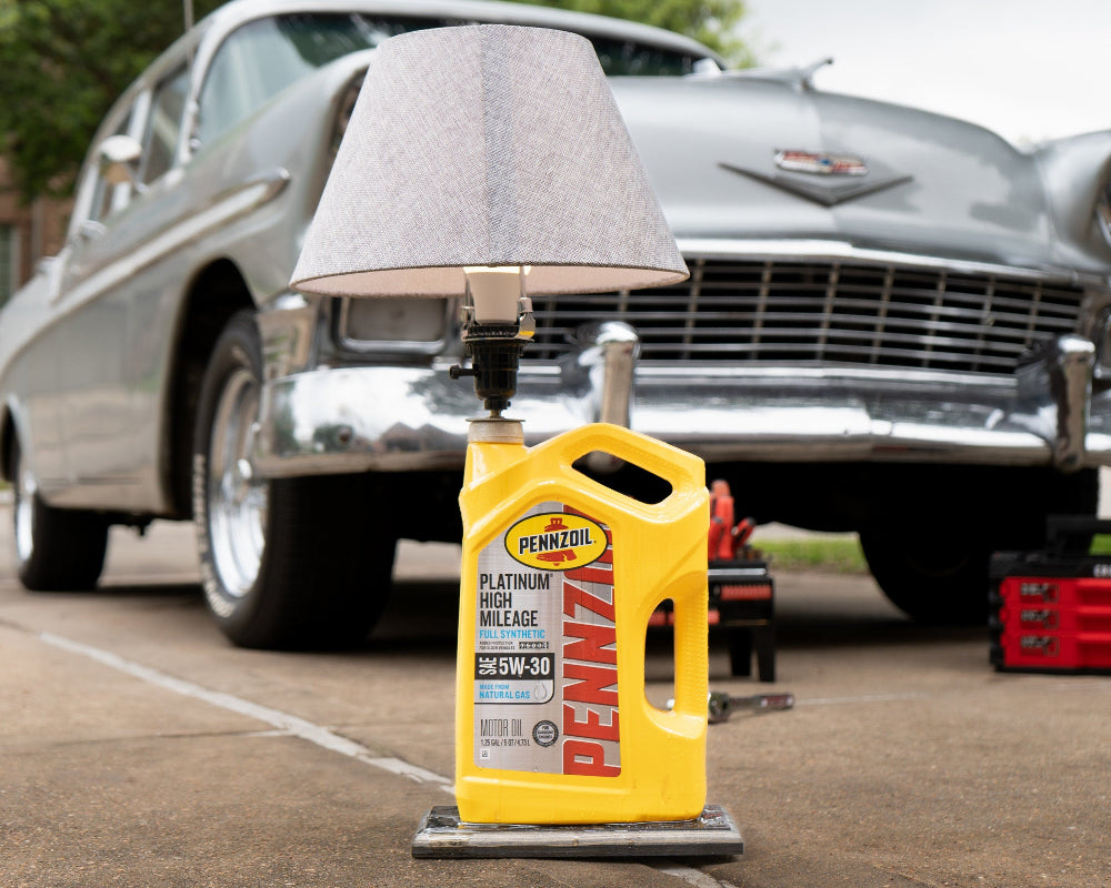 Motor oil jug lamp with epoxy drip effect designed for garages and automotive themed spaces.