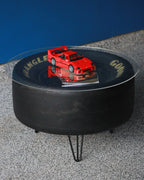 Motorsports display table made from authentic race used tire.