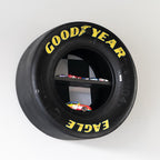 NASCAR collectible display shelf built from authentic race tire with internal shelving.