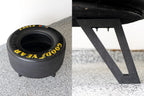 Collector racing tire table built from genuine motorsports equipment.