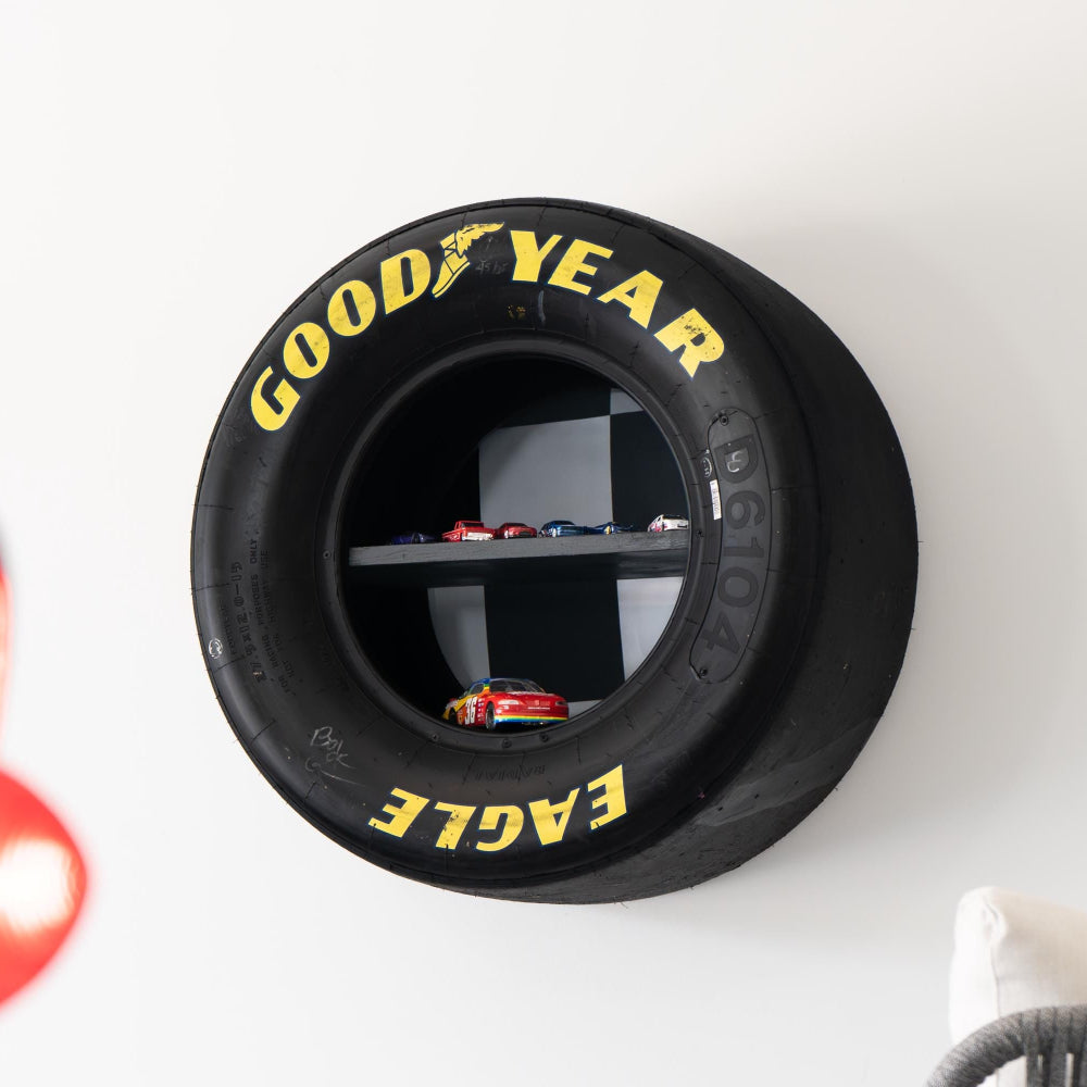 NASCAR tire wall shelf made from real race used Goodyear Eagle tire with built in display shelves.