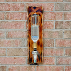 Precision shot liquor dispenser that mounts to wall and delivers controlled pours every time.