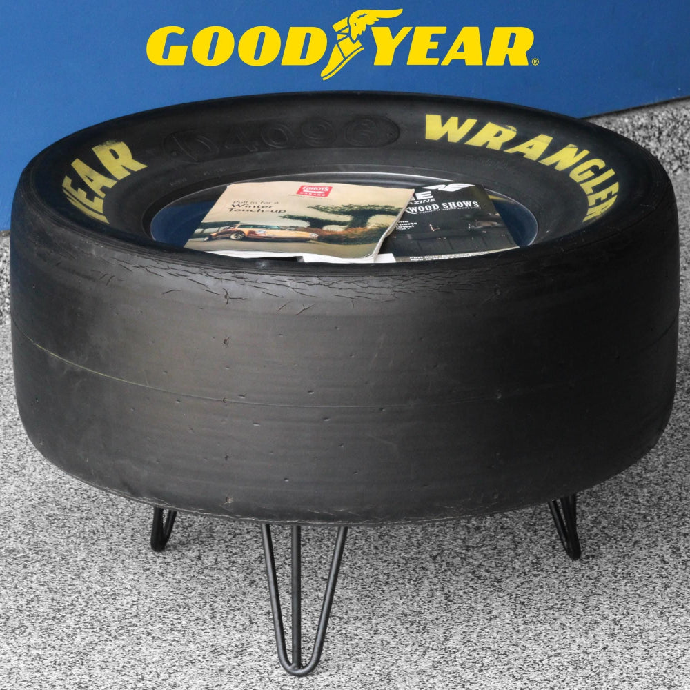 Coffee table built from an authentic Goodyear racing tire mounted on a wood base.