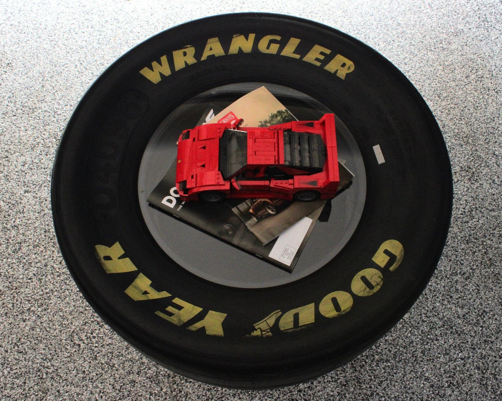 Single top tire table with clean smooth tabletop and exposed racing tire.