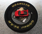 Single top tire table with clean smooth tabletop and exposed racing tire.