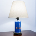 STP oil filter lamp built from real automotive parts, blending classic branding with industrial style lighting.
