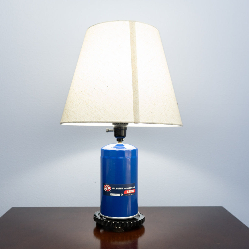 STP filter lamp crafted from a genuine oil filter and upcycled gear base.