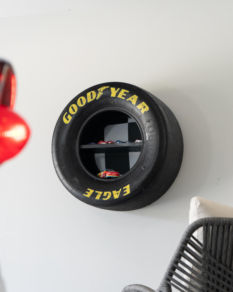 Close up of race used tire shelf showing real track wear and built in display compartments.