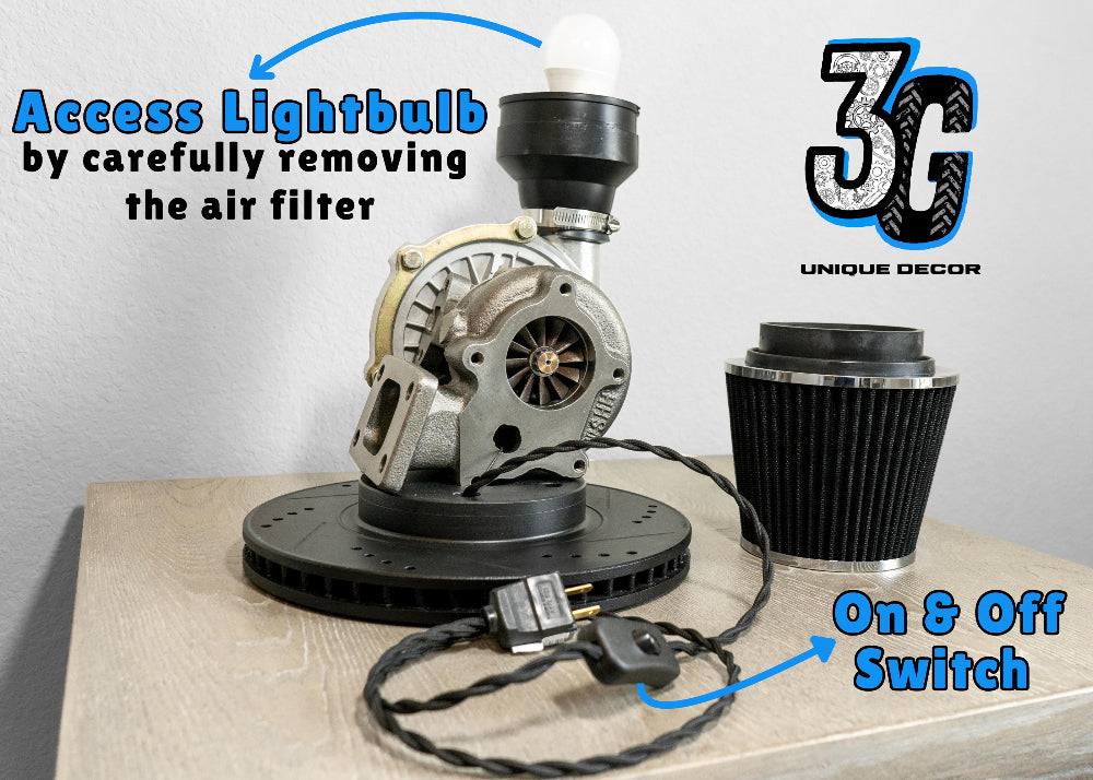 Industrial turbocharger lamp made from real car parts, blending automotive engineering elements with functional metal lighting.