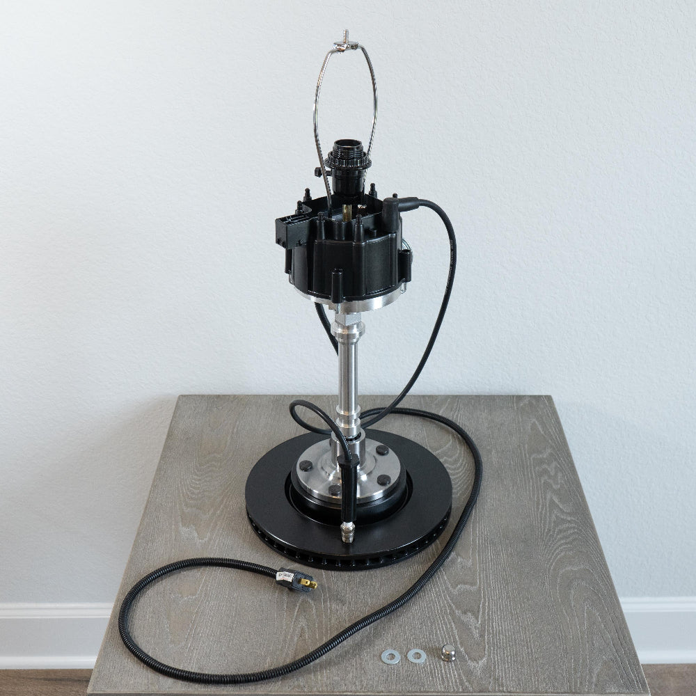 unique black distributor lamp made from genuine automotive components with bold mechanical presence.