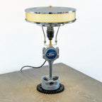 V8 Ford piston lamp built from authentic engine parts, combining mechanical character with functional interior lighting.