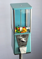 Vintage Astro gumball machine paired with a custom industrial stand, combining retro candy dispensing with sturdy display design.