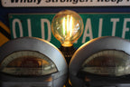 Vintage automobilia floor lamp made from a real parking meter, blending history with modern lighting.
