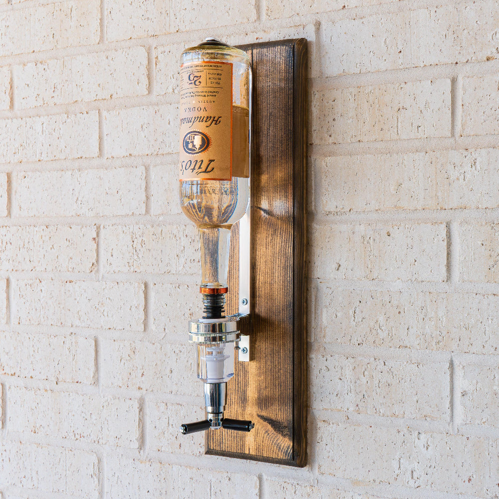 Wall mounted shot pour dispenser designed to deliver consistent pours with minimal mess.