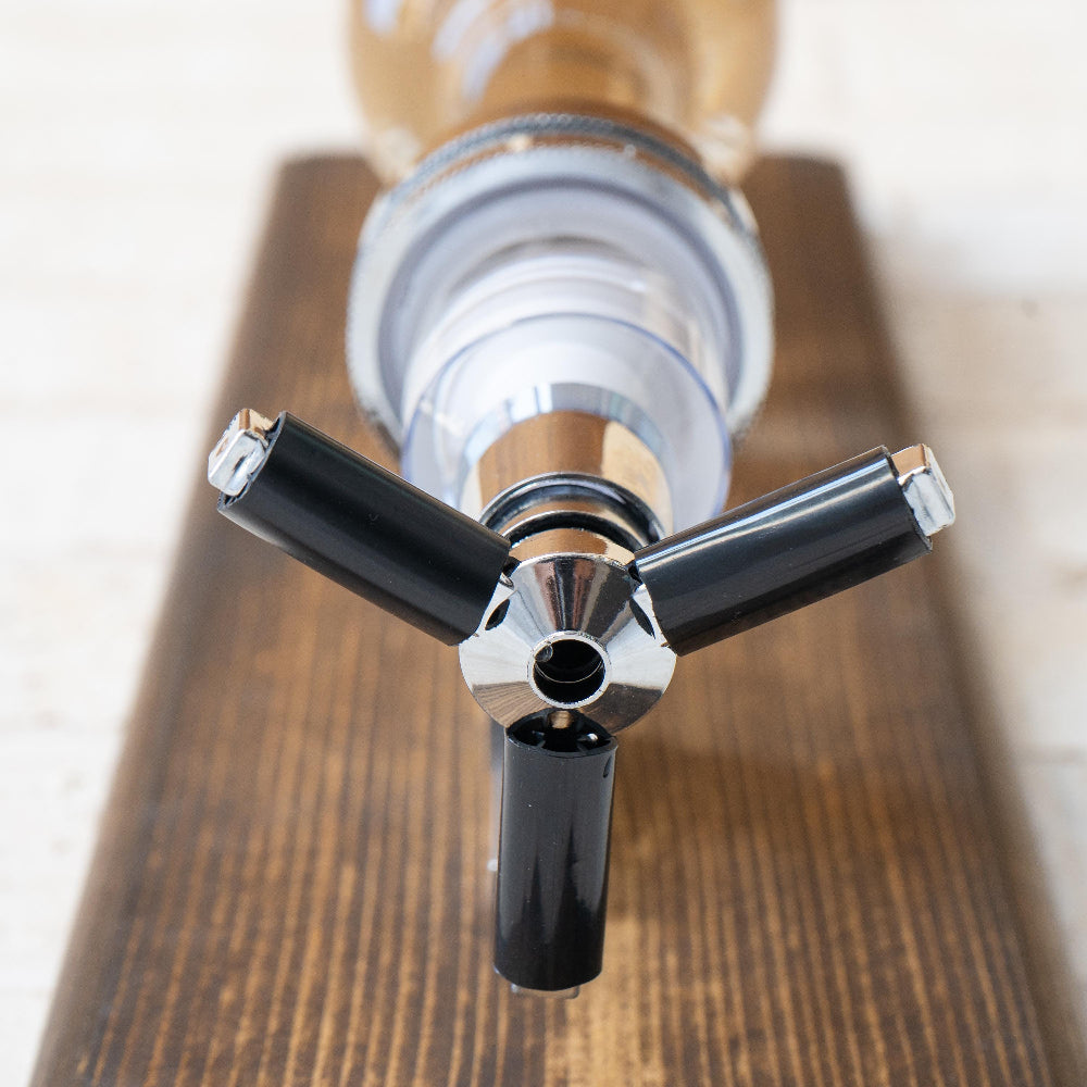 Whiskey bottle wall mount designed for space saving bar setups and easy pouring.