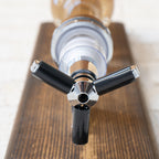Whiskey bottle wall mount designed for space saving bar setups and easy pouring.